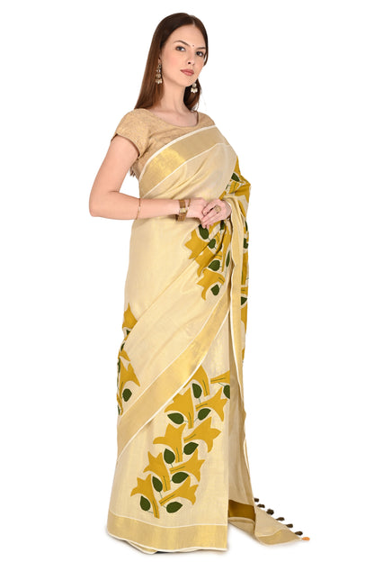 Handmade Cream Saree with Golden-Yellow Floral Applique & Tassel Detailing – Artisan Cotton Elegance